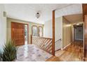 Spacious foyer with tile and hardwood flooring and wood accents at 957 Ross Ct, Stone Mountain, GA 30087