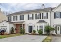 A charming townhome featuring a garage, well-maintained lawn and driveway at 32 Hampton Dr, Cartersville, GA 30121