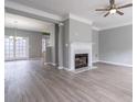 A spacious living room boasting a fireplace, modern floors, and elegant lighting at 32 Hampton Dr, Cartersville, GA 30121