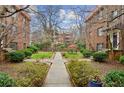 A condo complex featuring green courtyards and walkways in a well-maintained community at 694 Argonne Ne Ave # 4, Atlanta, GA 30308