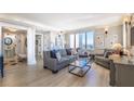 Bright and airy living room with hardwood floors, comfortable seating, and large windows showcasing city views at 75 14Th Ne St # 3160, Atlanta, GA 30309