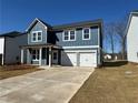 Beautiful two-story home with a double garage and well-maintained front yard at , Conyers, GA 30094