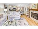 Open living area with a fireplace and dining space creating a warm, inviting atmosphere for relaxing at 300 Johnson Ferry Ne Rd # A712, Atlanta, GA 30328