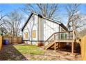 The backyard features new wood fencing, a small deck, and a patch of grass at 1114 Oak Knoll Se Ter, Atlanta, GA 30315