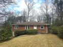 A single-story brick home featuring a lush front yard and an accessible ramp at 1288 N Emory N Pl, Atlanta, GA 30306