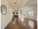 Inviting entryway with gleaming hardwood floors and modern lighting fixtures throughout at 164 Charolais Dr, Mcdonough, GA 30252