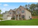 Beautiful two-story home featuring brick and siding, a manicured lawn, and attached garage at 164 Charolais Dr, Mcdonough, GA 30252