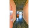 Hallway with an exposed brick wall and polished concrete floor at 319 Atlanta Se St # 110, Marietta, GA 30060