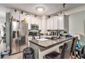 Well-equipped kitchen features stainless steel appliances, stone countertops, and ample cabinet space at 5019 Lower Elm St, Atlanta, GA 30349