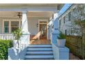 Charming front porch features classic columns, and a wooden door with glass panes, and is well-maintained at 565 Candler St, Atlanta, GA 30307