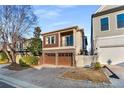 Charming home with a brick driveway and a two-car garage, perfect for urban living at 322 Gray Shingle Ln, Woodstock, GA 30189