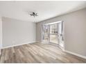 A spacious bedroom with wood floors, large windows and neutral paint at 5043 Bell Dr, Smyrna, GA 30080