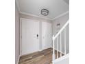Entryway featuring wood floors, fresh paint, and a staircase to the second floor at 5043 Bell Dr, Smyrna, GA 30080