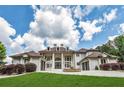 Impressive home with a grand entrance, water feature, and meticulously maintained landscaping at 535 Waters Way, Fayetteville, GA 30215