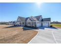 Beautiful single-Gathering home with a two-car garage, covered porch, and well-maintained landscaping at 5410 Crow Dr, Cumming, GA 30041