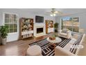 Bright living room boasts hardwood floors, fireplace, and built-in bookshelves at 641 Morningside Dr, Stockbridge, GA 30281