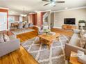 Spacious living room featuring hardwood floors, area rug, and ample seating at 789 Liberty Commons Nw Dr, Atlanta, GA 30314