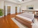 Comfortable main bedroom with hardwood floors and a ceiling fan at 789 Liberty Commons Nw Dr, Atlanta, GA 30314