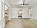 Empty living room with carpet flooring and a view to the kitchen at 162 Fairburn Sw Rd, Atlanta, GA 30331