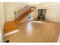 Open-concept living room featuring hardwood floors and lots of natural light at 949 Bobcat Se Ct, Marietta, GA 30067