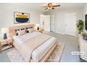 Spacious main bedroom with a ceiling fan and a light color palette at 949 Bobcat Se Ct, Marietta, GA 30067