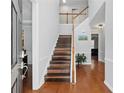 Inviting foyer with hardwood floors and a staircase leading to the upper level at 1090 Fountain Head Ln, Lawrenceville, GA 30043