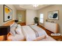 A staged main bedroom showcases a tray ceiling, a decorative ceiling fan, and light-filled space at 115 Sable Ridge Dr, Acworth, GA 30102