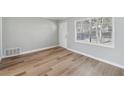 Inviting living room with beautiful hardwood floors, natural light, and a fresh coat of paint at 10152 Griffin Sw Ln, Covington, GA 30014