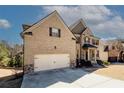 Charming two-story brick home with a two-car garage and well-maintained landscaping at 4594 Marching Ln, Fairburn, GA 30213