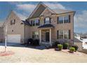 Charming two-story brick home with a two-car garage and well-maintained landscaping at 4594 Marching Ln, Fairburn, GA 30213