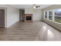 Spacious living room with fireplace, hardwood floors and large windows overlooking the backyard at 507 N Gwinnett St, Buford, GA 30518