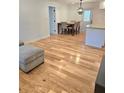 Bright dining room with hardwood floors, a modern light fixture, and dining table at 2308 Baywood Se Dr, Atlanta, GA 30315