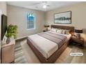 Comfortable bedroom with a queen bed, modern furniture, and ample natural light at 29 Saint James Pl, Sharpsburg, GA 30277