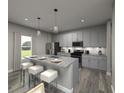 Modern kitchen with granite countertops, stainless steel appliances, and breakfast bar seating at 4760 Hemingway Trl, Cumming, GA 30041