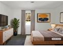 Cozy bedroom with soft lighting, neutral decor, a plush rug, and a serene atmosphere at 5407 Effingham Ct, Lithonia, GA 30038