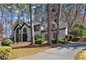 Beautiful two-story home boasts a modern exterior with manicured lawn and long driveway at 203 Northside Nw Dr, Kennesaw, GA 30144