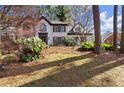 Charming two-story brick home with lush landscaping on a sunny lot at 203 Northside Nw Dr, Kennesaw, GA 30144