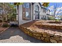 Lovely brick home with a unique retaining wall and fresh landscaping at 203 Northside Nw Dr, Kennesaw, GA 30144