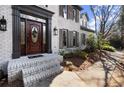 Inviting home exterior featuring a decorative wood front door with sidelights at 203 Northside Nw Dr, Kennesaw, GA 30144