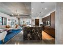 Modern kitchen featuring a large granite island with bar seating, sleek wood cabinets, and stainless steel appliances at 845 Spring Nw St # 502, Atlanta, GA 30308