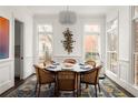 Refined dining room with ample natural light, sophisticated chandelier, and seating for six, ideal for formal gatherings at 895 Inman Village Ne Pkwy, Atlanta, GA 30307