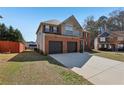 Spacious two-story brick home featuring a two-car garage, walkway, and a well-manicured lawn at 4316 Constellation Blvd, Snellville, GA 30039