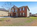 Two-story brick home with a two-car garage, complemented by a well-maintained front lawn at 4316 Constellation Blvd, Snellville, GA 30039