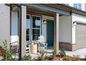 Inviting front porch with rocking chairs, stylish decor, and charming brick accents at 600 Belshire Dr, Acworth, GA 30102