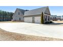 Spacious three-car garage with an extended driveway, offering ample parking at 112 Standford Dr, Mcdonough, GA 30252