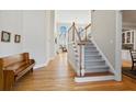 Bright foyer with hardwood floors, staircase, and soaring ceilings at 7455 Richmond Way, Cumming, GA 30040