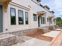 A new townhouse complex features neutral colors, landscaping, and individual entryways at 001 White St # 1, Marietta, GA 30060