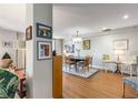 Charming dining area features an adjacent living area with stylish decor and hardwood floors at 1501 Clairmont Rd # 535, Decatur, GA 30033