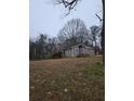 View of the exterior of the home and surrounding lot at 5709 Lee St, Morrow, GA 30260