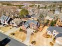 Wide aerial view of the property and surrounding neighborhood in a suburban setting at 2885 Towne Village Dr, Duluth, GA 30097